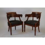 A Pair of Early 19th Century Walnut Arm Chairs. Cira 1840. Each carved in high relief with Rams Head