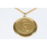 A gold colour metal pendant depicting head and shoulder of Mary on gold colour metal neck chain
