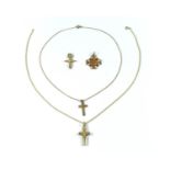 A collection of gold crosses with chains