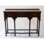 An Oak Side Table. Circa 1900. Fitted with three frieze drawers. On six turned legs. 76cm x 106cm