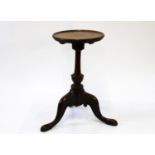A George II Mahogany Kettle Stand. Circa 1750. With a circular dished top above a turned column