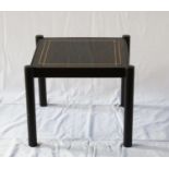 A glass topped metal coffee table 45cm square