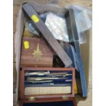 A small collection of early rulers and a wooden cased set of scientific instruments, together with