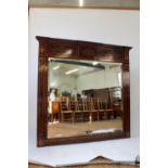 A Sheraton Stle Mahogany Over Mantle Mirror. 19th century. With bevelled plate glass. The frame