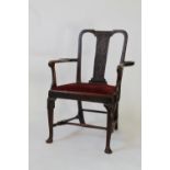 A Fine Irish Mahogany Arm Chair. Cira 1740. The splat carved with foliate scrolls on matted