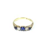An 18 carat diamond and sapphire five stone ring, size M