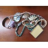 A small collection of jewellery to include silver earrings, silver bracelets, pendants, a green