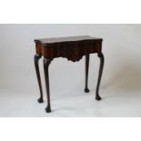 A Good Late George II Red Walnut Tea table. Circa 1750. The shaped top opening to reveal a