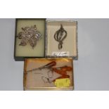 A small collection of jewellery including amber jewellery and two pieces of costume jewellery