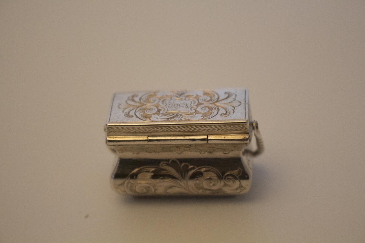 A Mid Victorian Sterling Silver Vinaigrette. In the form of a purse with swing handle. Makers mark - Image 2 of 2