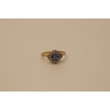 A gold colour ring set with a diamond and sapphire cluster, no hallmark, size P