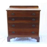 A Mahogany Chest of Four long Graduated Drawers. Cira 1900. In George III style. On bracket feet.