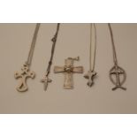 Five silver cross pendants with four silver neck chains