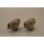 A Pair of Edwardian Sterling Silver Pepperettes. Each in the form of a Chick. London 1906.Each 4cm