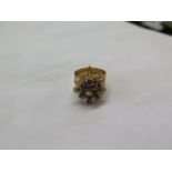 A gem set ring. Size K and a half