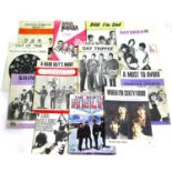 A collection of illustrated music sheets, including The Beatles, Rolling Stones, Yardbirds, Small