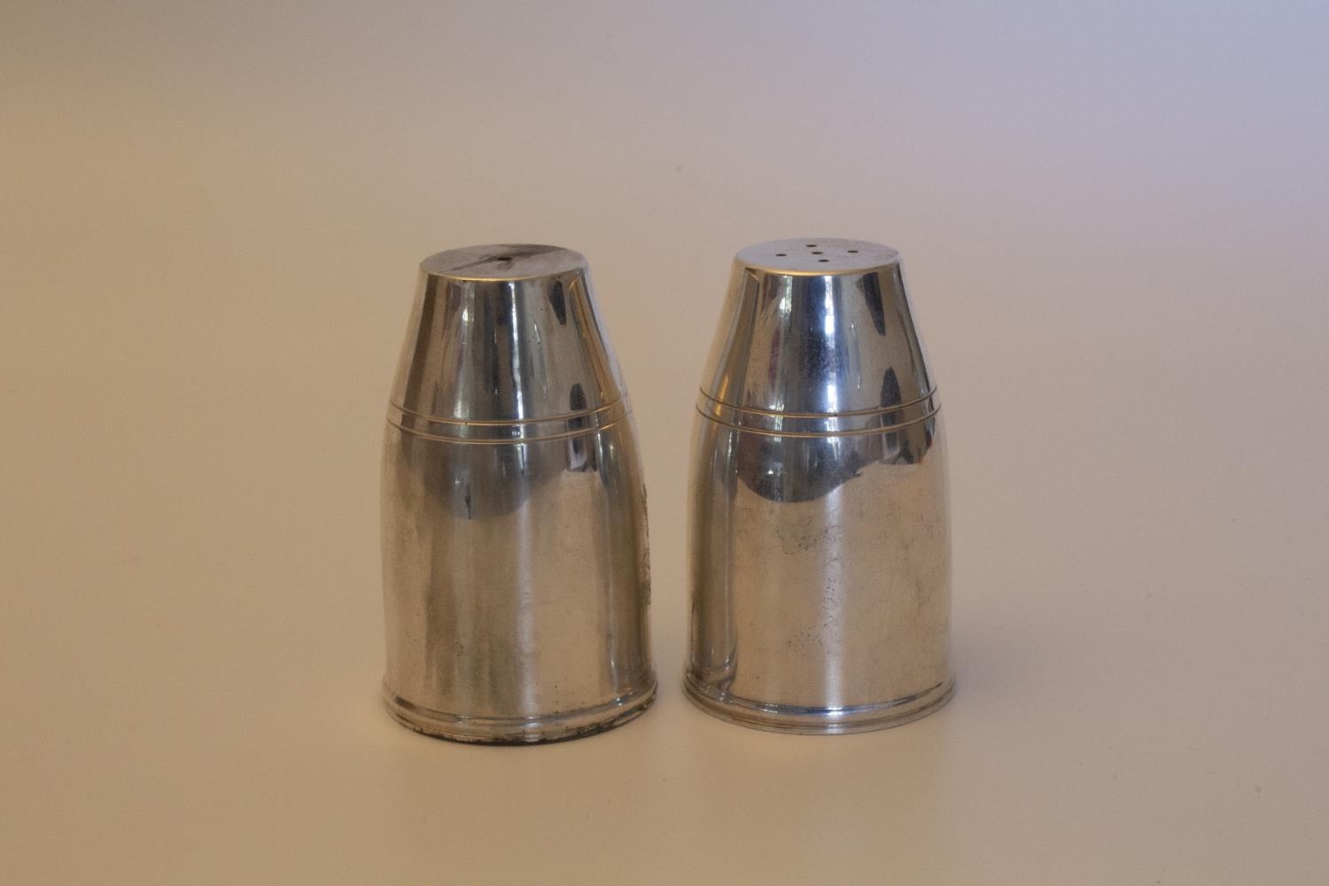 A Pair of Modern Sterling Silver Condiments. London 2001. Each in the form of an Artillery Shell.