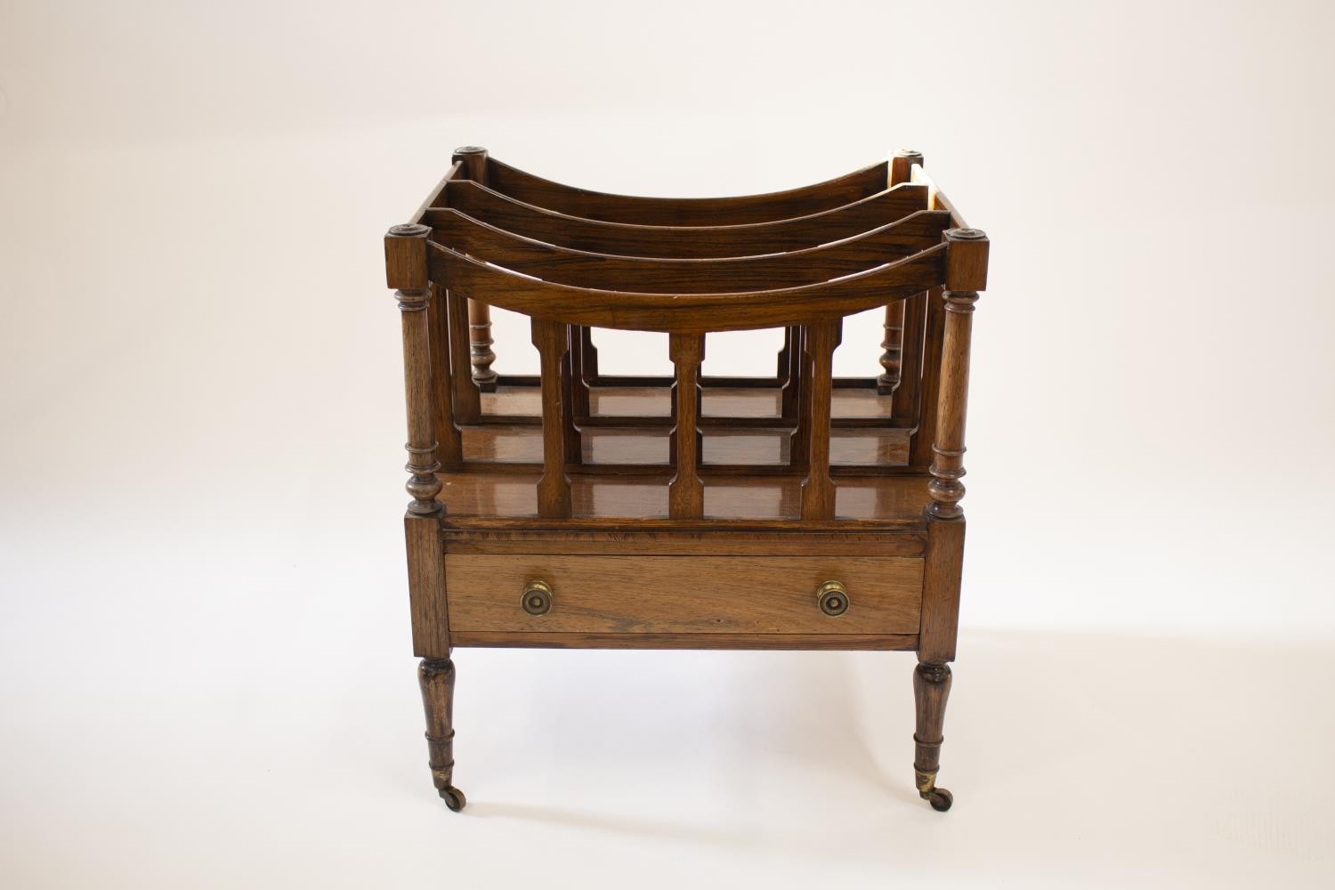 A George III Mahogany Canterbury. Circa 1800.Of typical form. Fitted with a single frieze drawer.