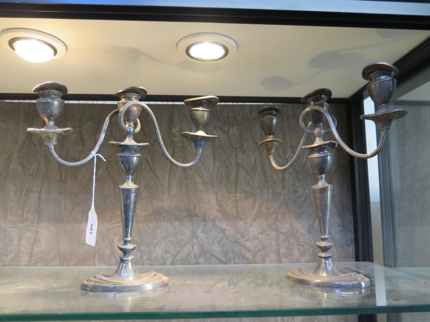 A pair of silver plate candelabra 28cm