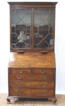 A George III Mahogany Bureau Bookcase. Circa 1770. The upper portion with a stepped cornice above