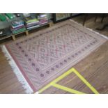 A Bokara style rug with geometric motifs on a dark pink ground, within a multiple border, 206cm x