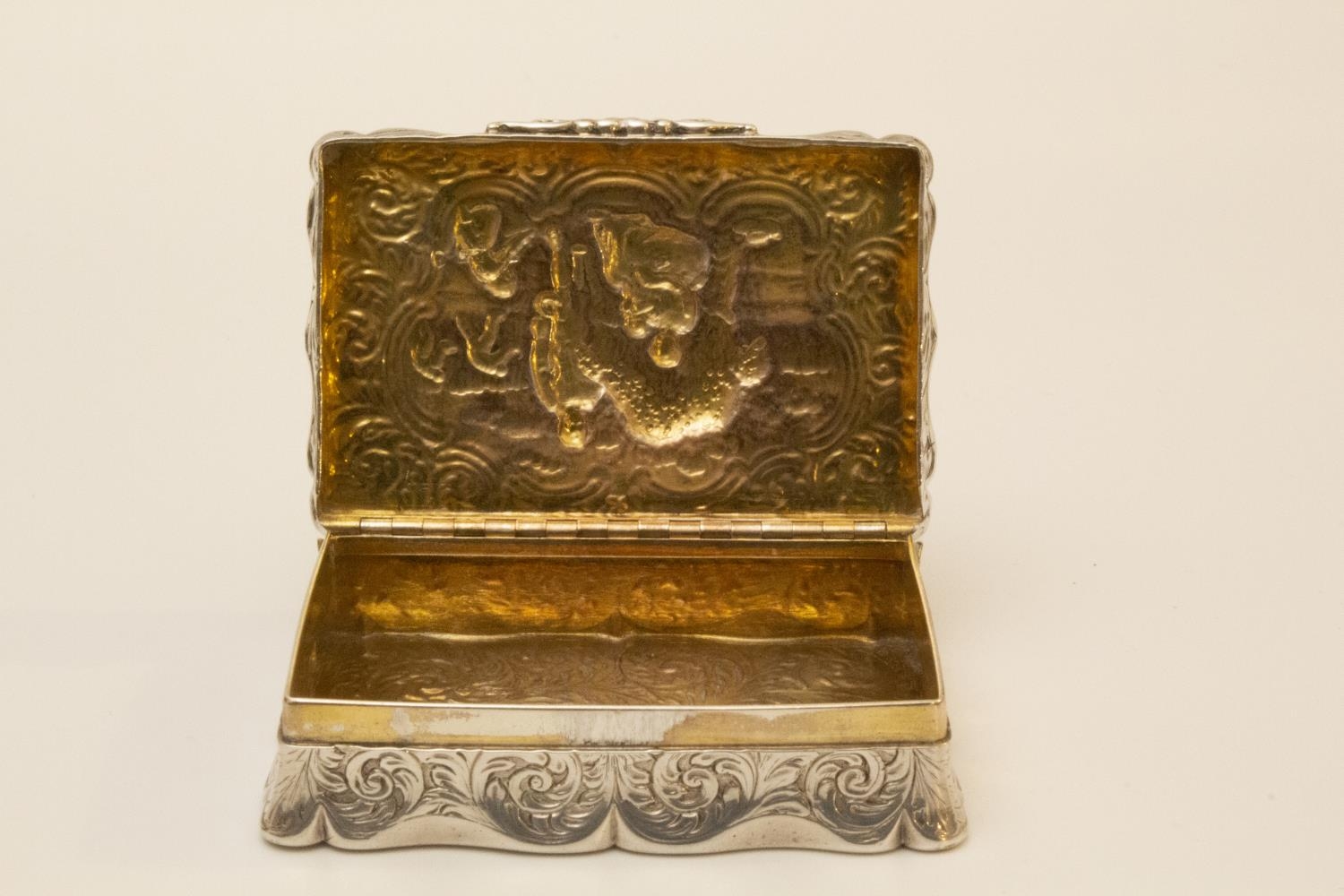 A George IV Sterling Silver Table Snuff Box. Edward Smith. Birmingham 1829. Embossed with figures in - Image 2 of 4