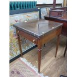 An Early 20th century Mahogany card table. The top with four folding leaves opening to reveal a