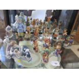 Two Lladro and one Nao figure groups and thirteen Goebel children figures (16)