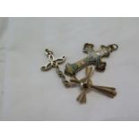 Two 9 carat gold cross 12g and an enamel cross on metal