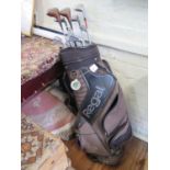 Thirteen golf clubs with holdall
