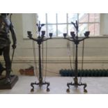A Pair of Regency Bronze Five light Candelabra. Each cast with a Heron Standing on top of a