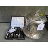 A silver plated biscuit barrel and a cased set of six spoons