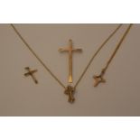 A collection of gold colour metal crosses and broken neck chains