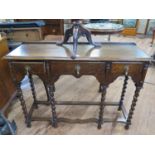 An Oak Side Table. Circa 1900. Fitted with three frieze drawers. On six turned legs. 76cm x 106cm