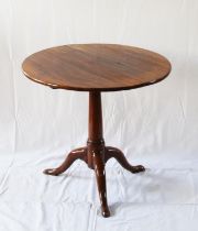 A George III mahogany Tripod Table. late 18th century. With large open rub joint to top. 65cm x 75cm