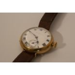 A lady's wrist watch gold colour with enamel dial and Arabic numerals