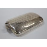 An Large American Sterling Silver Hip Flask. With gold pique decoration. Shaped to fit the pocket.