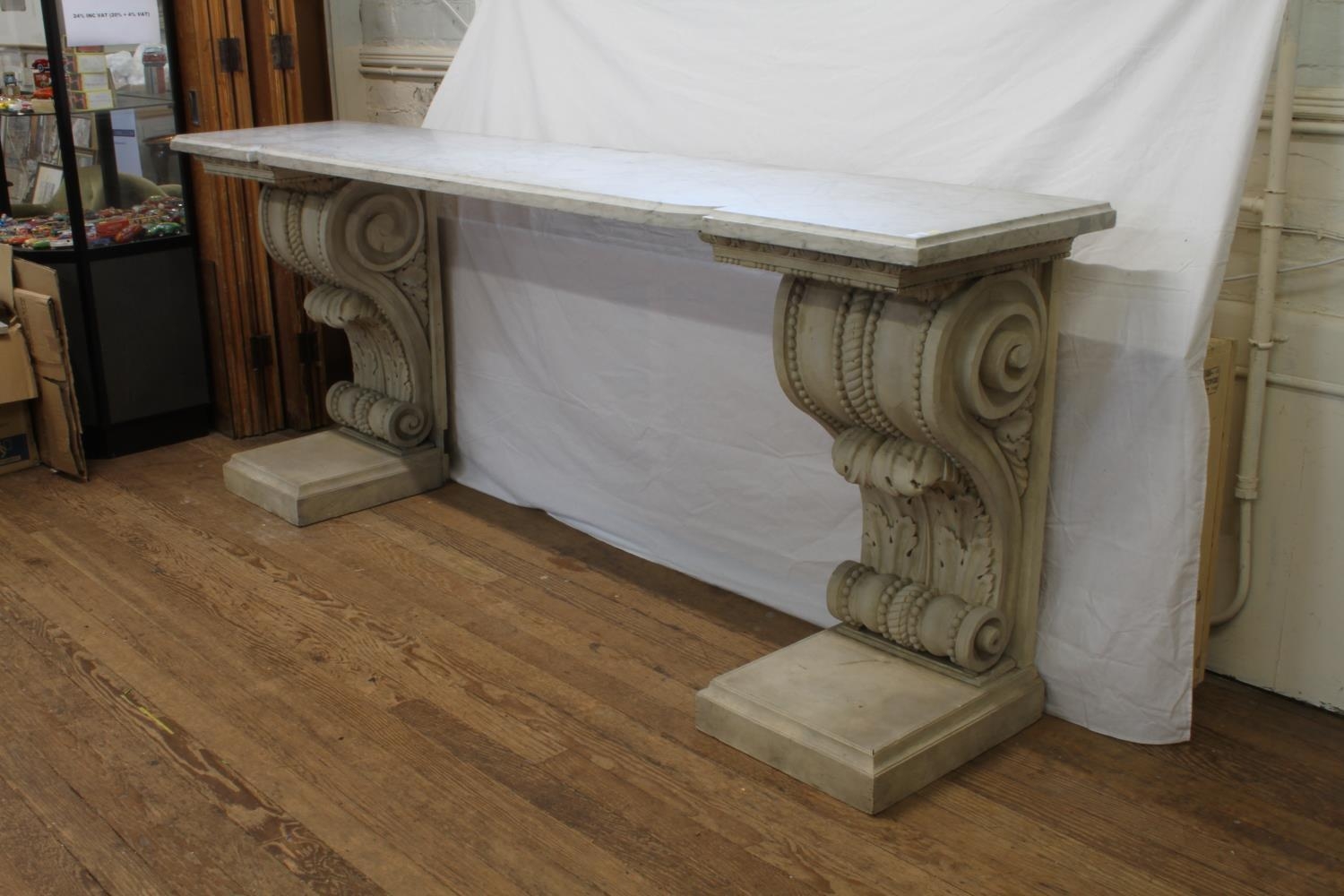 A massive late 18th century Console table. Of architectural proportions. The wooden base carved in