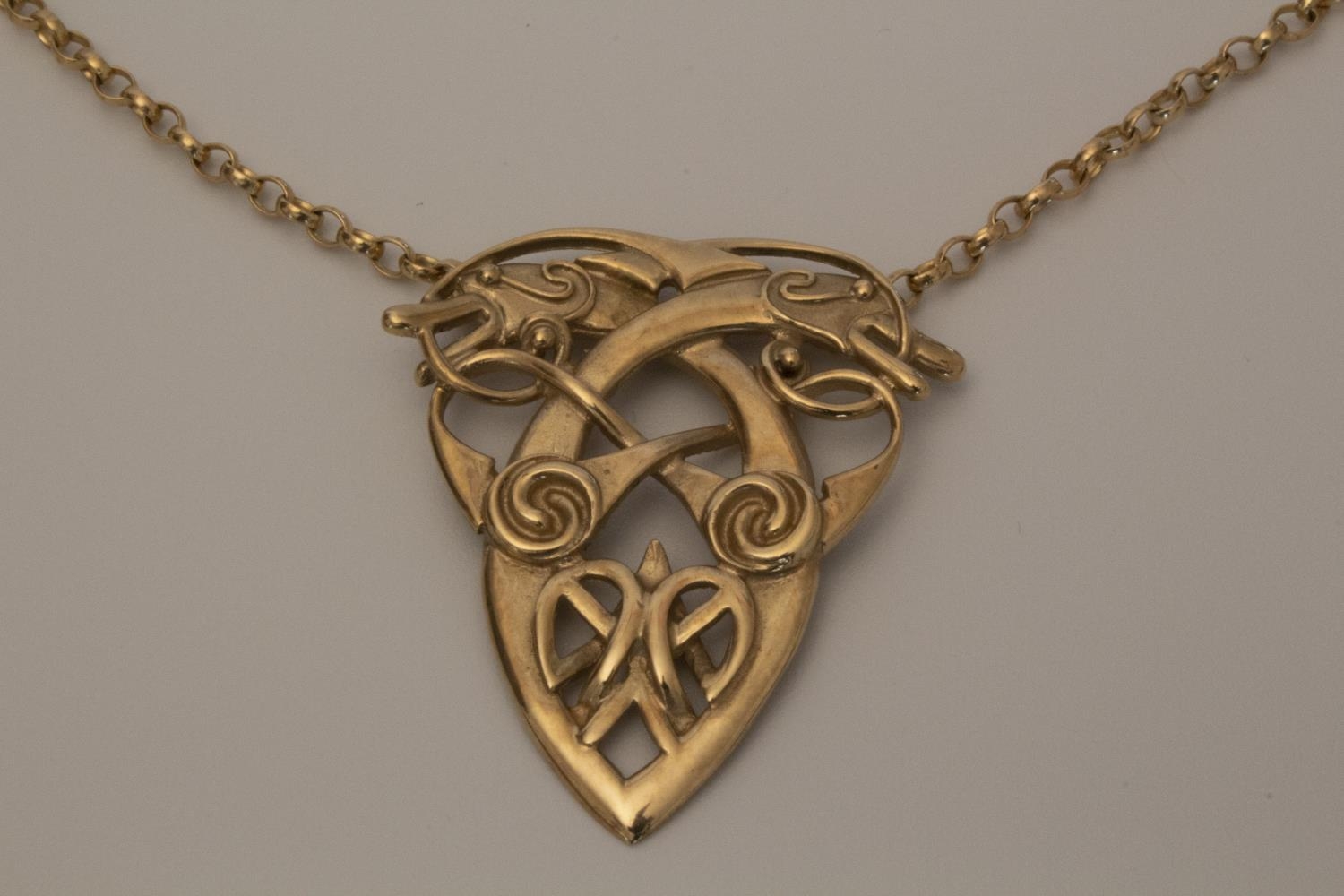 A 9 carat gold pendant in the Celtic style on a 9 carat gold neck chain 12g