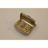 A George III Sterling Silver Vinaigrette. Circa 1800. In the form of a purse. 3cm wide.