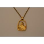 A gold pendant and chain 14 grams