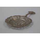 An English Tea Strainer in Continental style. Levi & Salaman. Birmingham 1863. Cast with exotic