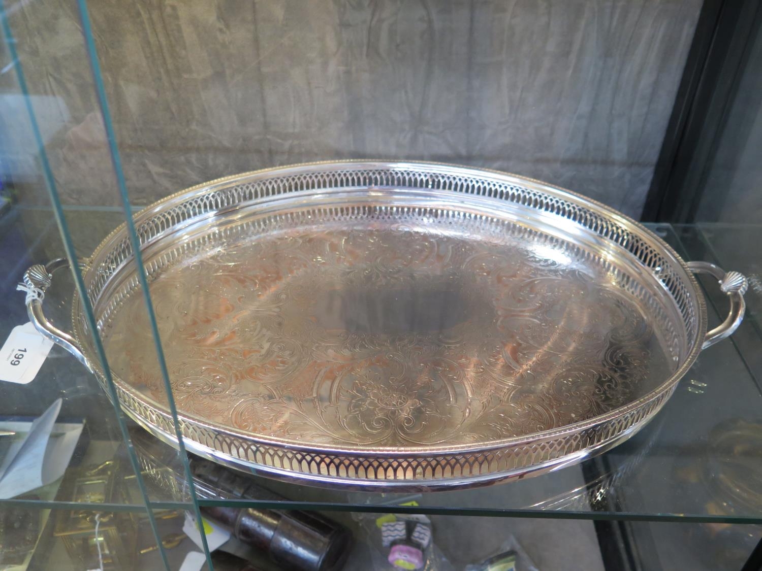 An oval silver plated tray with pierced galley rim and handles 54cm