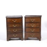 A PAIR OF MAHOGANY BOW FRONT BEDSIDE CHESTS each with four drawers and brass swan neck handles,