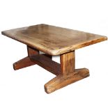 A ZIMBABWEIAN HARDWOOD DINING TABLE constructed from railway sleepers, 179cm wide x 102cm deep x