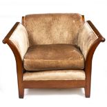 A LARGE UPHOLSTERED ARMCHAIR with sleigh arms and square tapering legs, 111cm wide x 103cm deep x