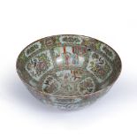 A 19TH CENTURY CHINESE FAMILLE VERTE PUNCH BOWL decorated with figures in cartouches and birds on