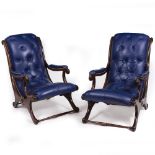 A PAIR OF BLUE LEATHER BUTTON UPHOLSTERED ARMCHAIRS with mahogany frames, 63cm wide x 92cm deep x