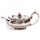 A WILLIAM IV SILVER TEAPOT of squat form with reeded decoration, marks for London 1827, 29cm wide