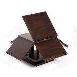 A MAHOGANY FOUR SIDED ROTATING MUSIC STAND 31.5cm square with the flaps down x 32cm high